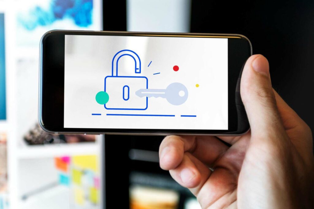 Phone with animated images of a lock and key on the screen.