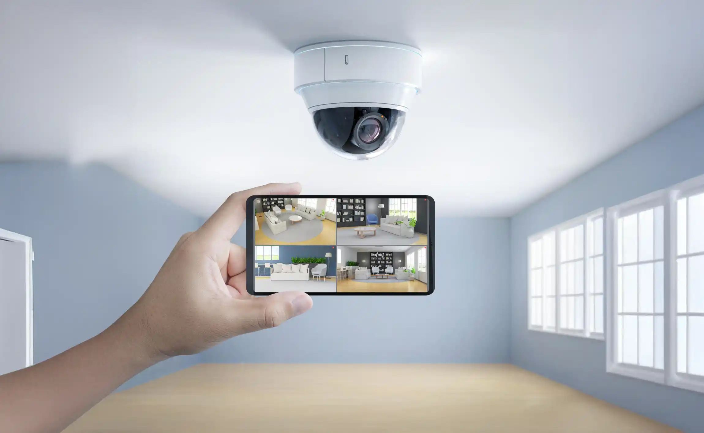 Person viewing security footage on smartphone.