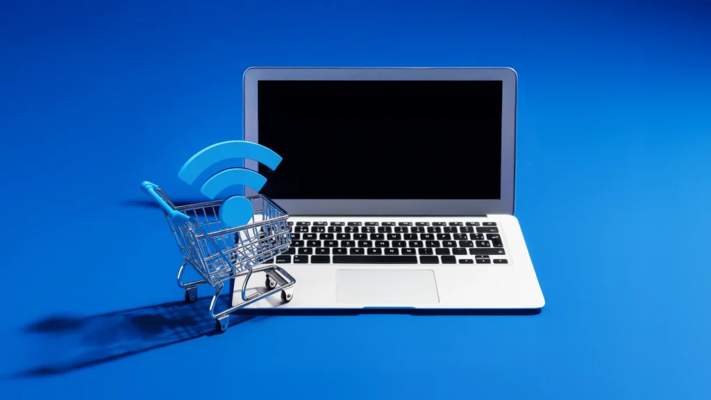 Laptop with shopping cart and Wi-Fi symbol